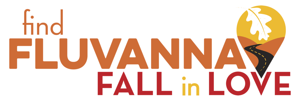 Autumn-colored and branded logo statement "Find Fluvanna, Fall In Love" with an oak leaf in a map pin logo